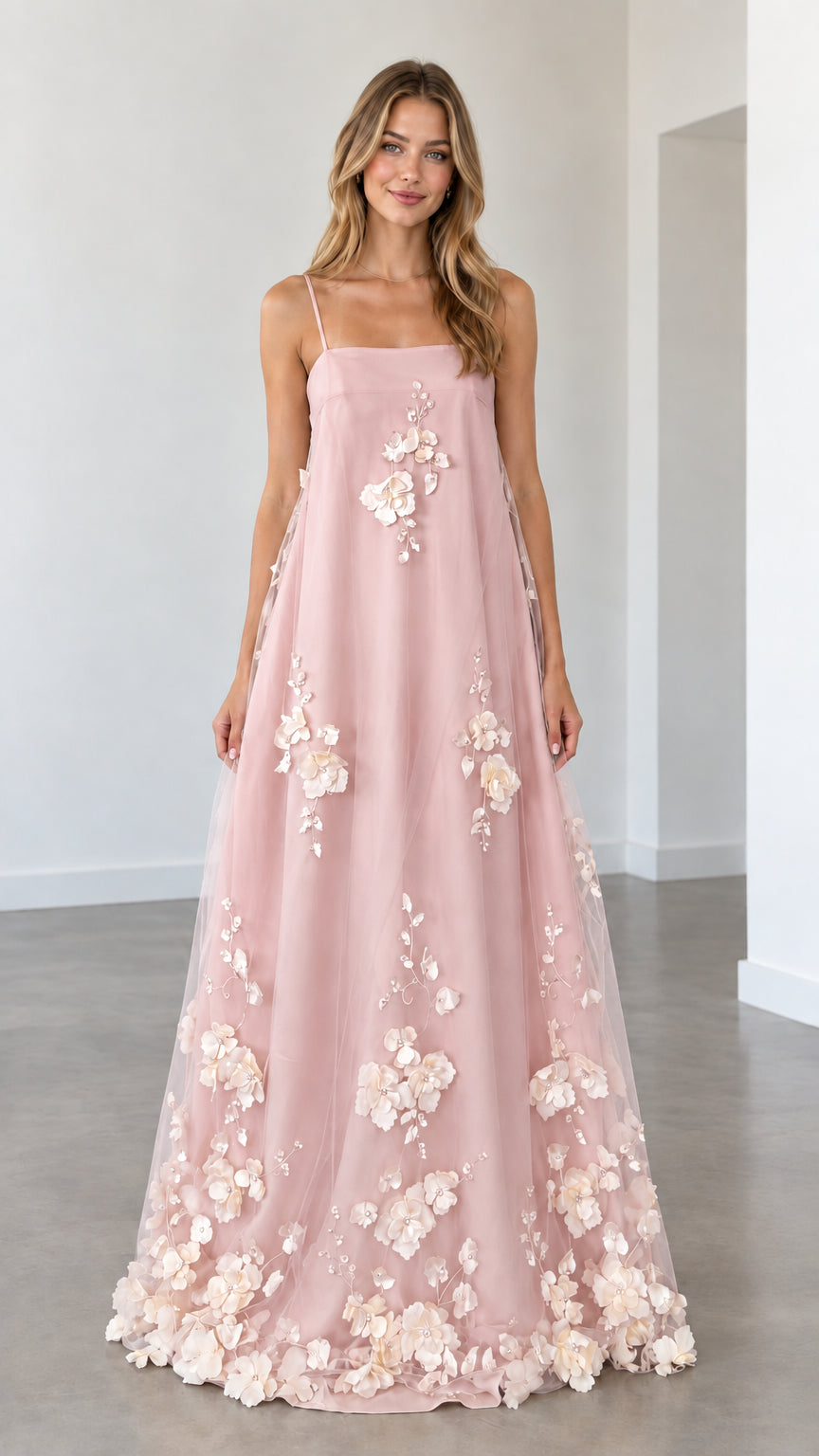 Model wearing blush pink 3D floral applique spaghetti strap maxi dress
