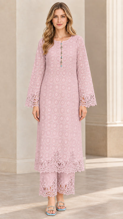 Front view of woman wearing blush pink eyelet lace tunic and coordinated wide-leg pants