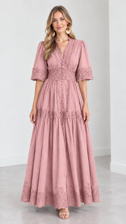 Front view of woman wearing a dusty pink V-neck lace trim tiered maxi dress