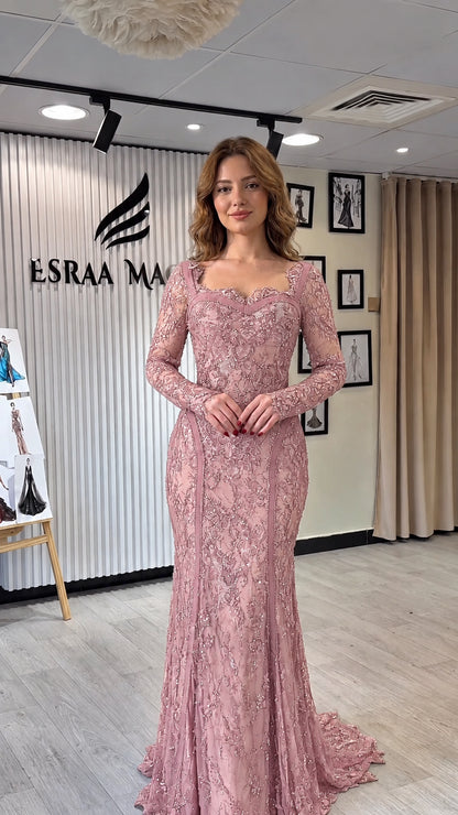 Full-length front view of dusty pink long sleeve lace mermaid gown