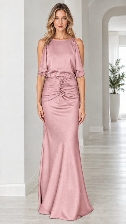 Front view of model wearing blush pink satin open back evening dress