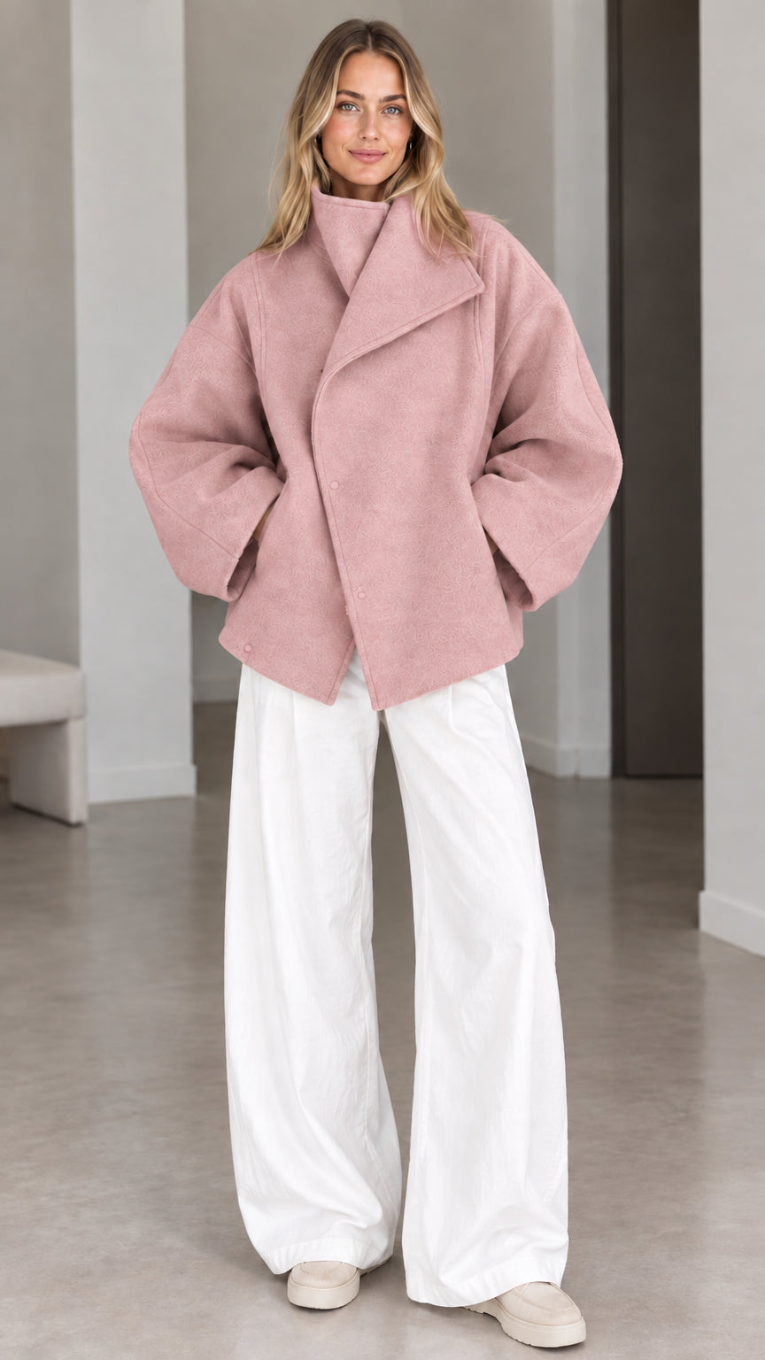 Model wearing dusty pink fold-over collar relaxed short coat