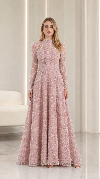 Full-length front view of blush pink embellished illusion high-neck maxi evening gown