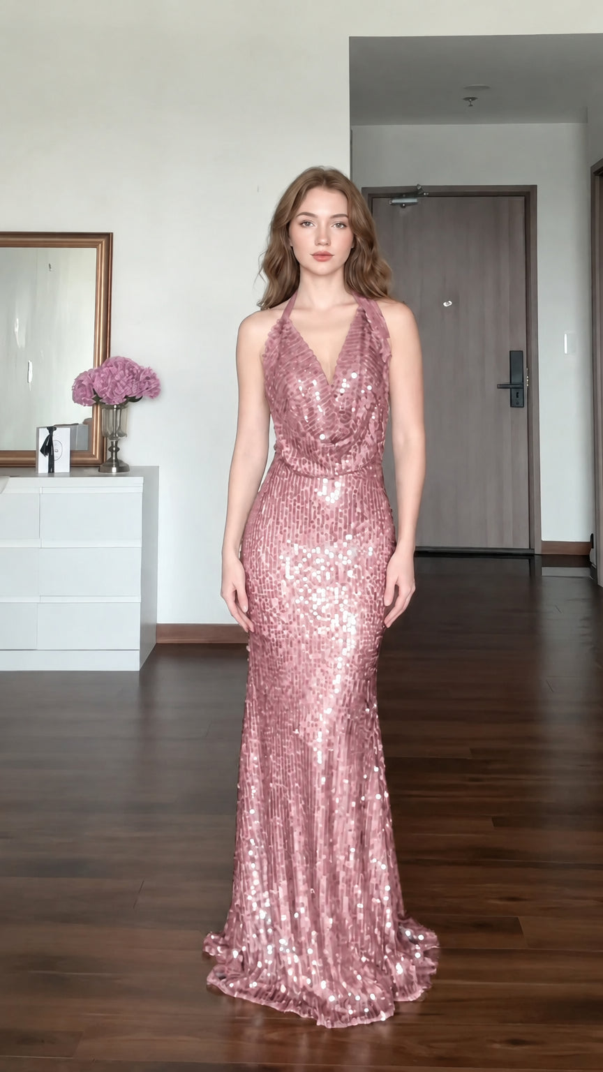 Front view of rose gold pink halter cowl neck sequin evening gown on model