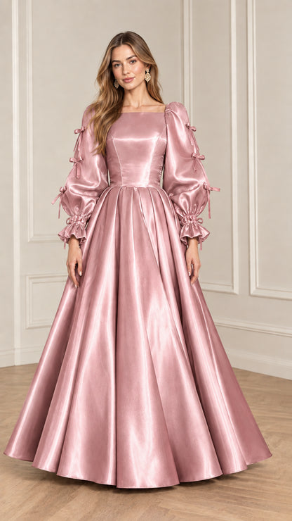 Full-length front view of model wearing Rose Pink satin puff sleeve ball gown
