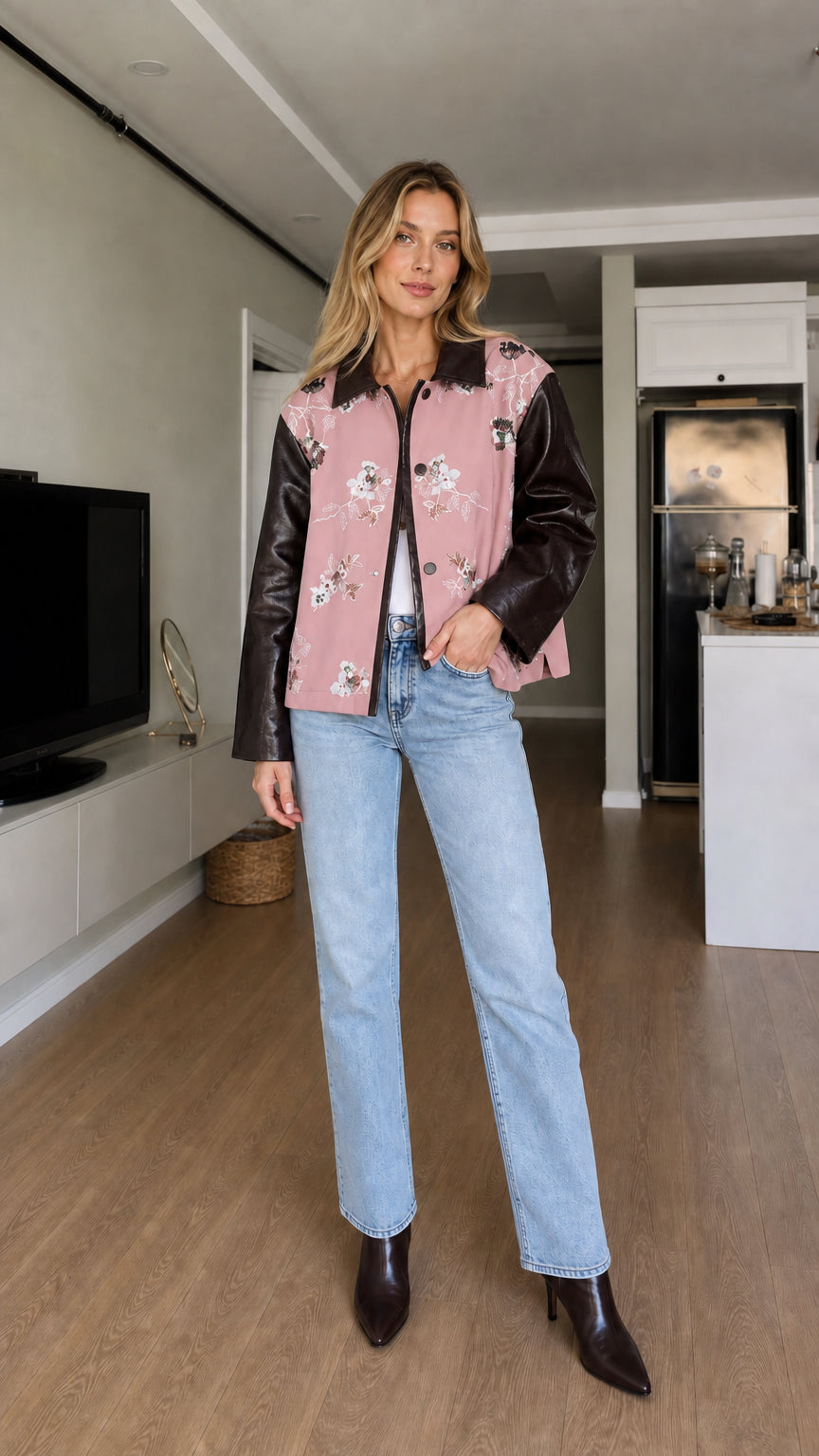Full-body front view of model wearing dusty pink floral embroidered contrast sleeve jacket