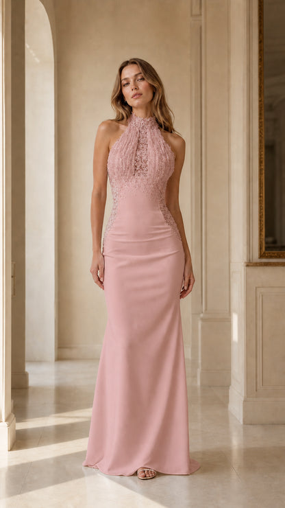 Front view of woman wearing blush pink halter beaded fringe mermaid evening gown