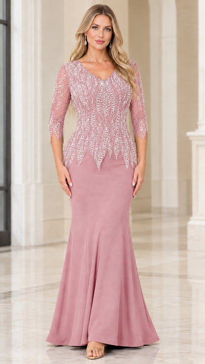 Woman wearing dusty rose pink rhinestone embellished 3/4 sleeve formal gown