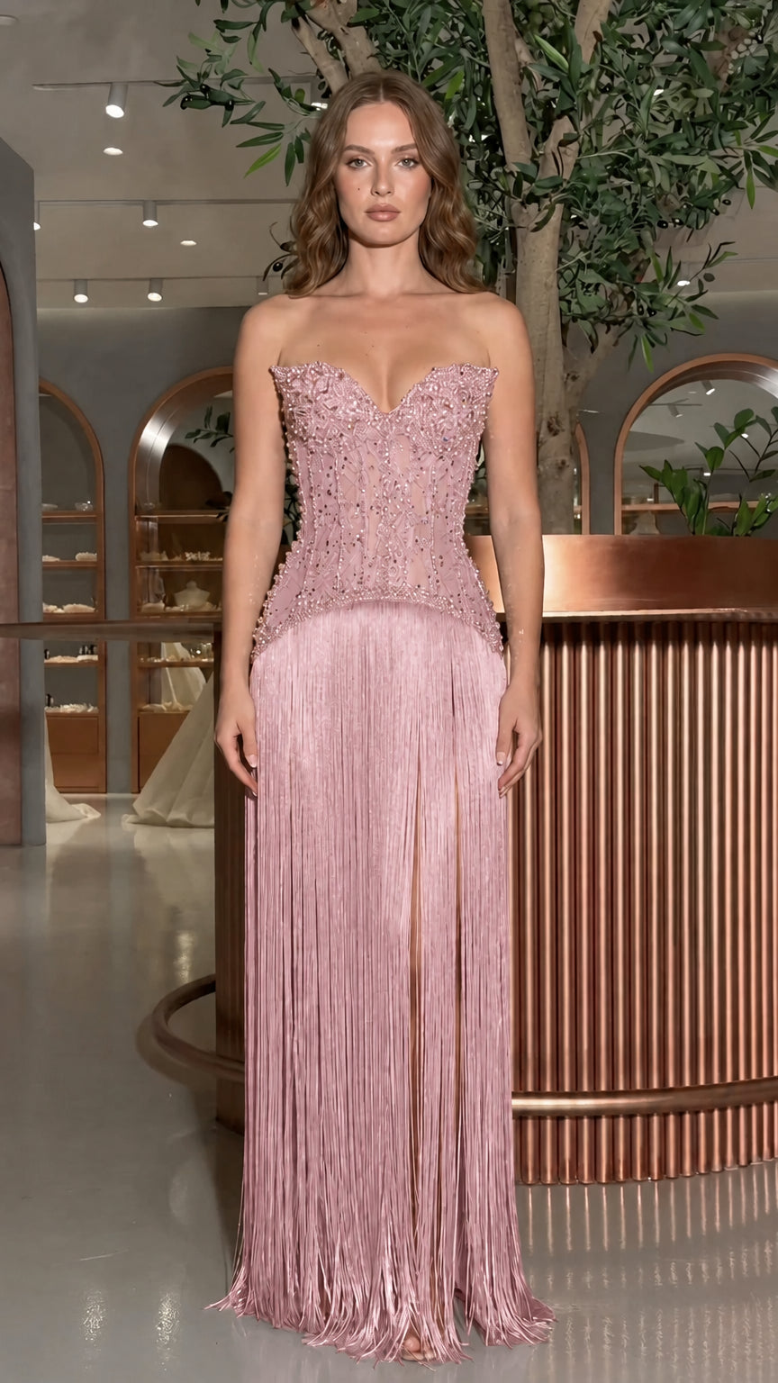 Front view of model wearing the dusty pink beaded corset fringe evening gown