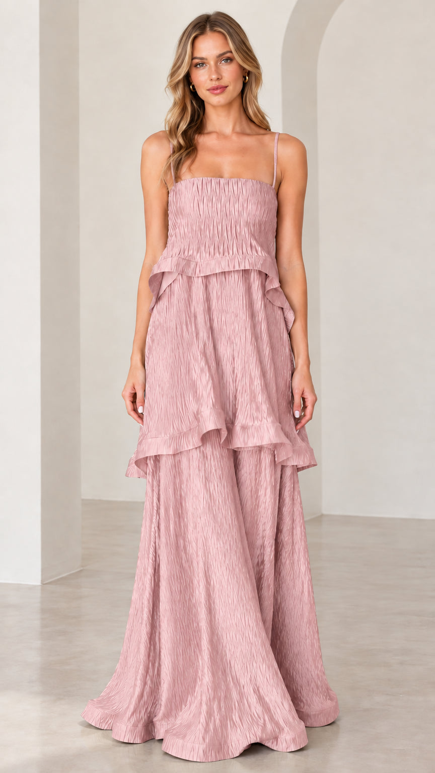 Model wearing dusty pink textured tiered sleeveless maxi dress
