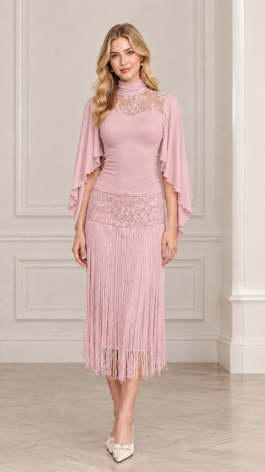 Front view of model wearing dusty pink lace cape sleeve tassel midi dress