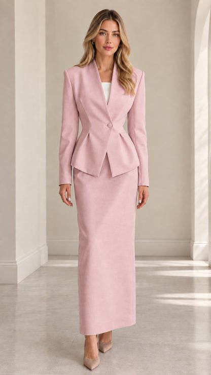 Model wearing blush pink peplum blazer and matching long skirt set