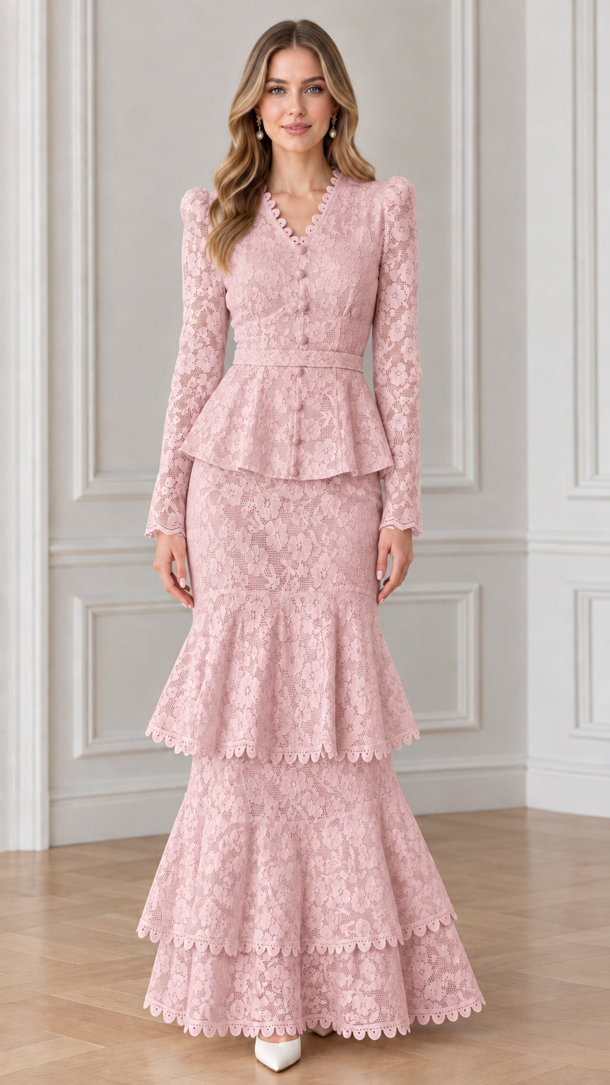 Front view of woman wearing blush pink floral lace belted peplum mermaid gown