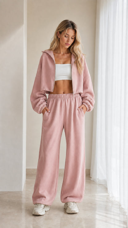 Model wearing dusty pink 2-piece cropped hoodie and wide leg sweatpants set