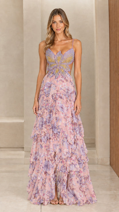 Model wearing blush pink floral tiered maxi dress with embellished butterfly bodice