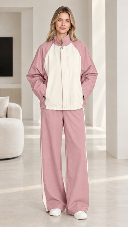 Dusty rose pink and cream colorblock two-piece tracksuit set on model
