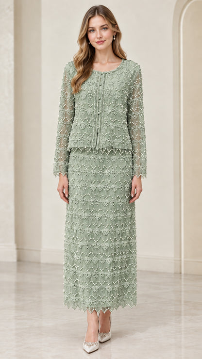 Front full-length view of woman wearing sage green beaded two-piece maxi skirt suit