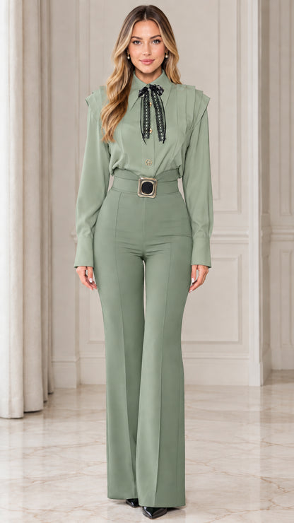 Model wearing sage green monochrome tailored flare jumpsuit with lace tie