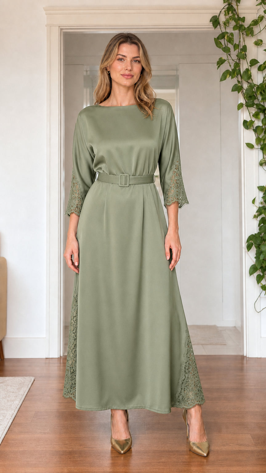 Front view of model wearing sage green satin maxi dress with lace trim