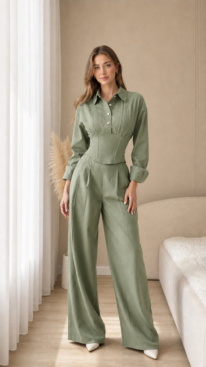 Full-length view of sage green tailored corset shirt and flowy pants outfit