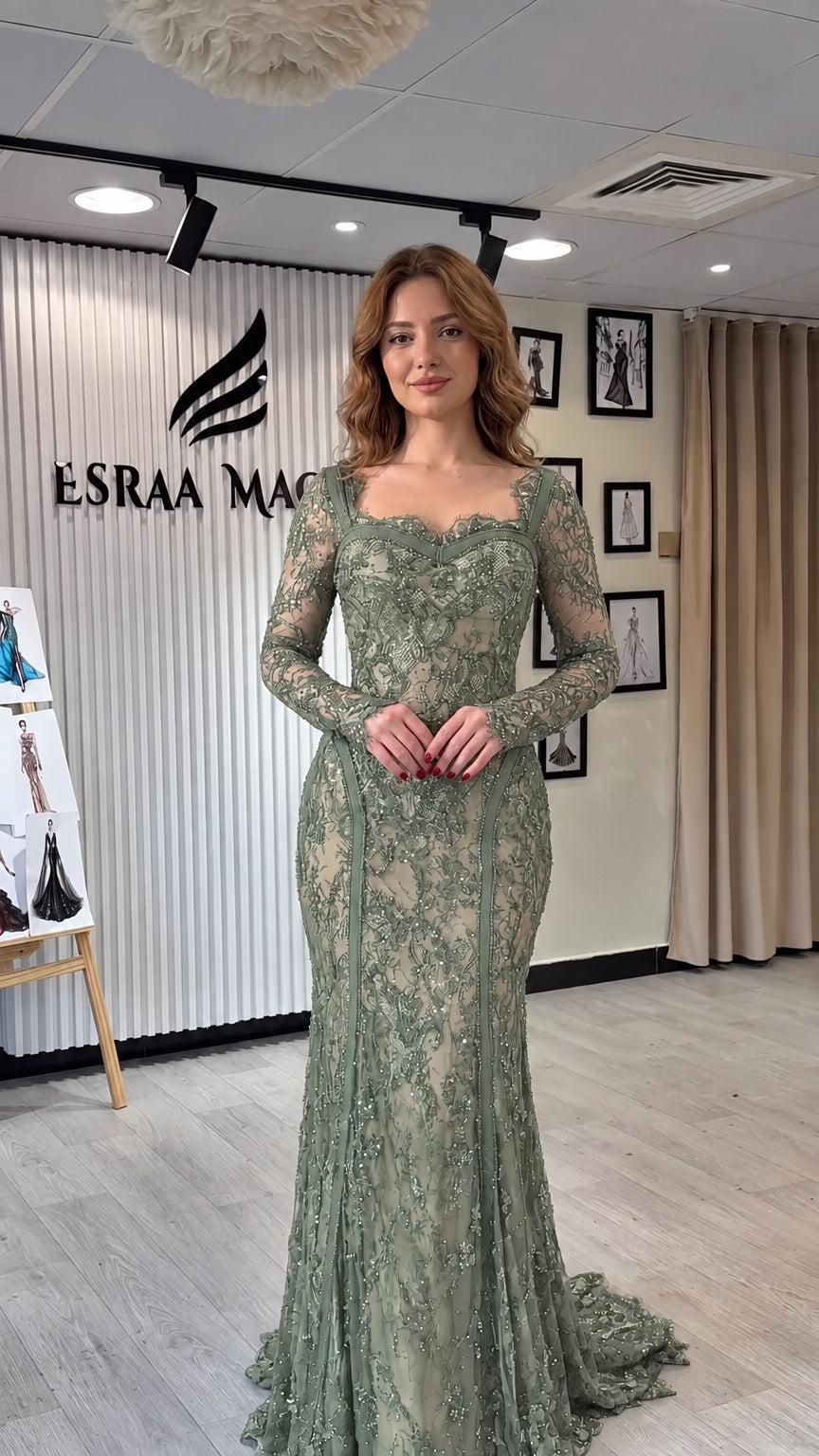 Full-length front view of sage green long sleeve lace mermaid gown