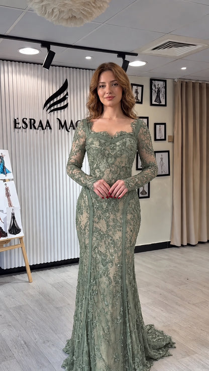 Full-length front view of sage green long sleeve lace mermaid gown