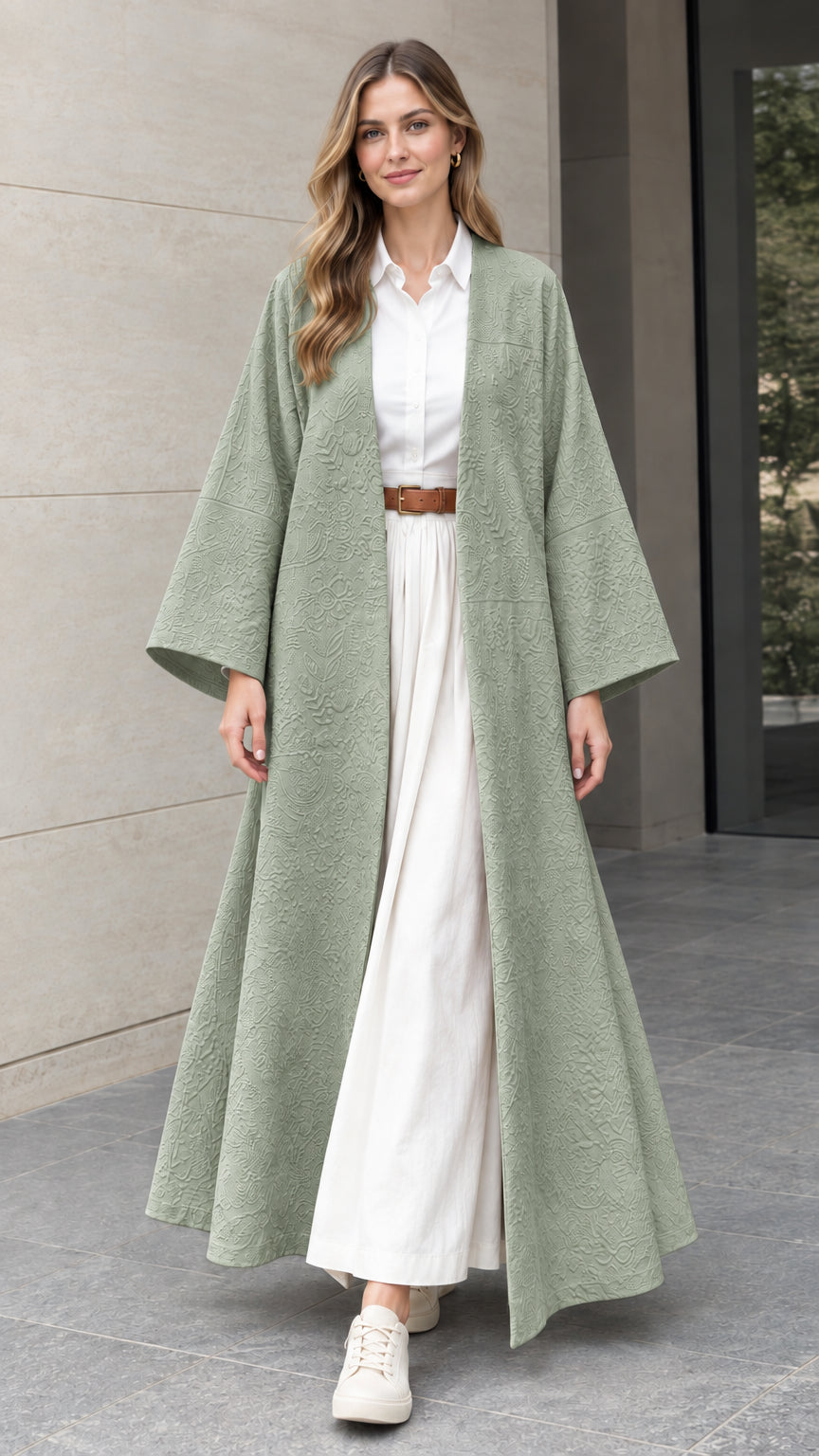 Front full-length view of woman wearing sage green embossed jacquard open-front duster