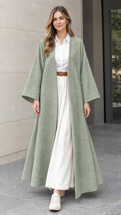 Front full-length view of woman wearing sage green embossed jacquard open-front duster