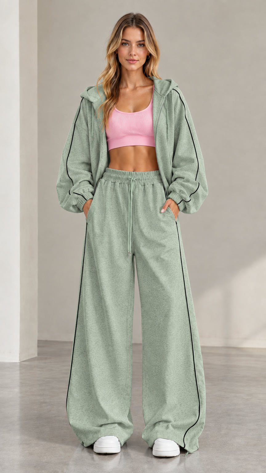 Model wearing Sage Green two-piece tracksuit set with contrast stripe