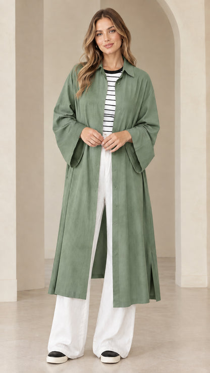 Model wearing sage green wide sleeve long duster shirt dress