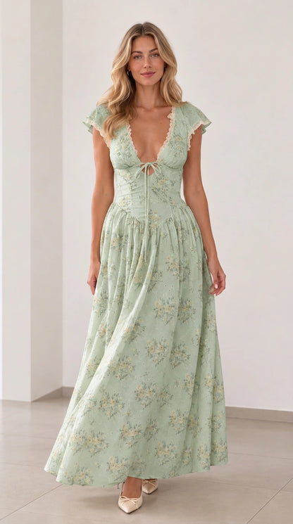 Front view of woman wearing sage green floral plunging tie-front maxi dress