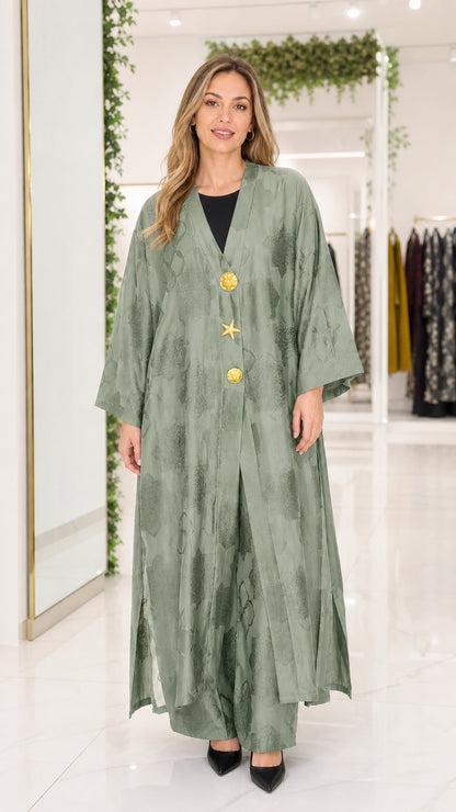 Front view of sage green jacquard maxi abaya with gold buttons