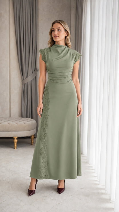 Full-length view of woman wearing sage green cap sleeve evening dress