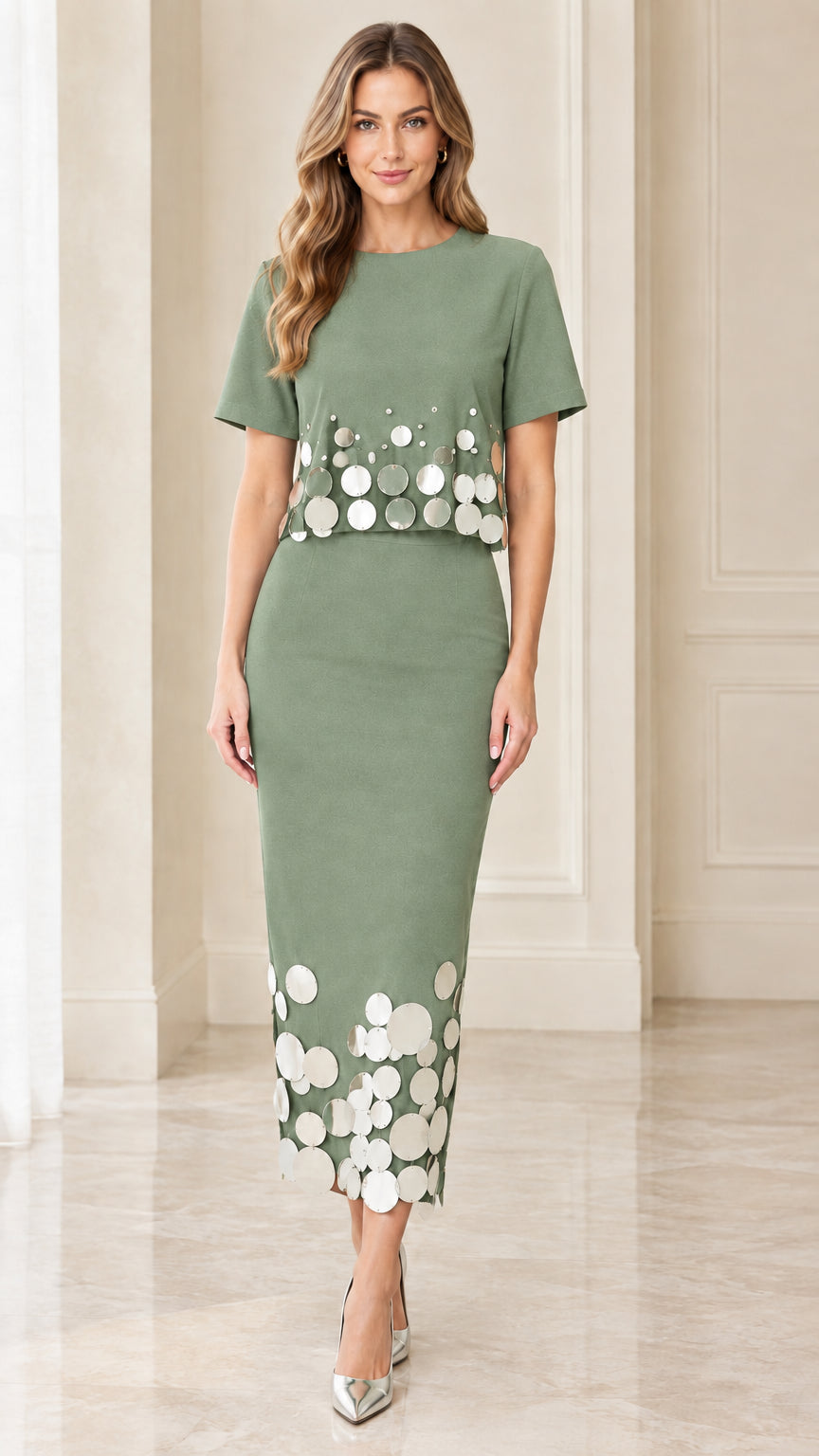 Front view of sage green column dress with metallic disc embellishments