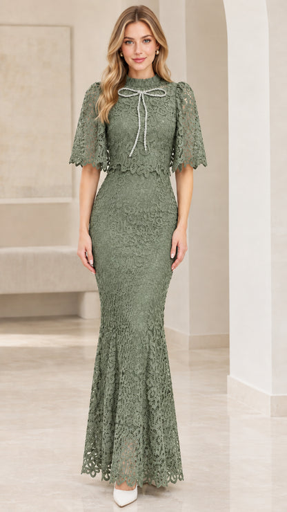 Front view of sage green lace capelet evening gown
