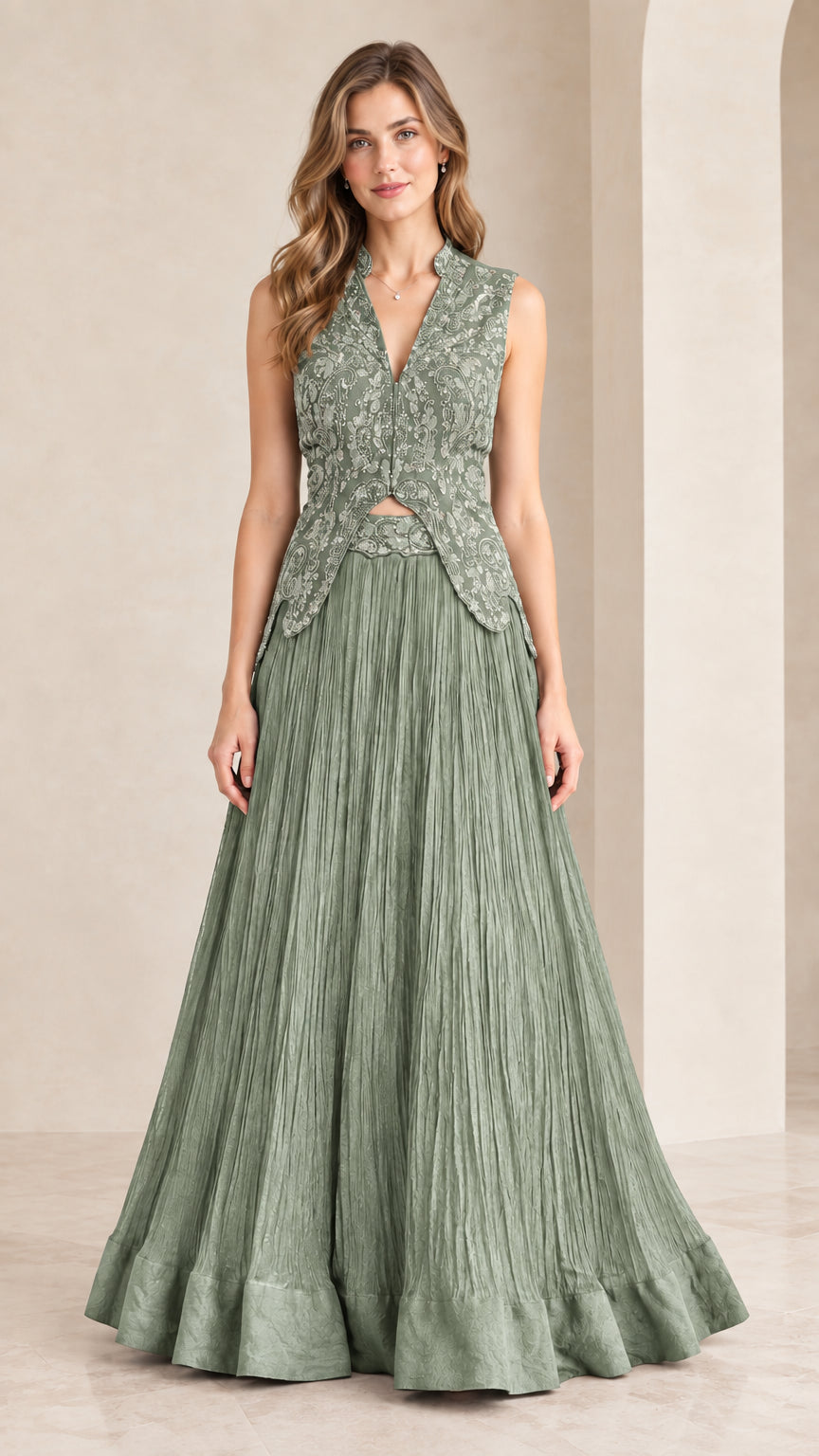 Front view of woman wearing sage green embroidered sleeveless maxi gown set