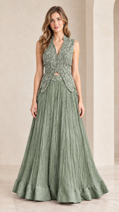 Front view of woman wearing sage green embroidered sleeveless maxi gown set