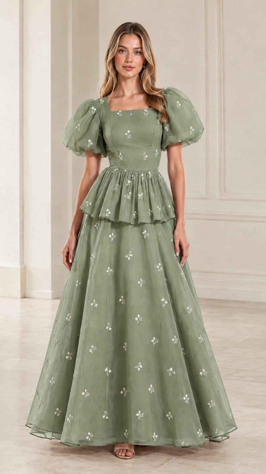 Full-length view of woman wearing sage green embroidered puff sleeve peplum maxi gown