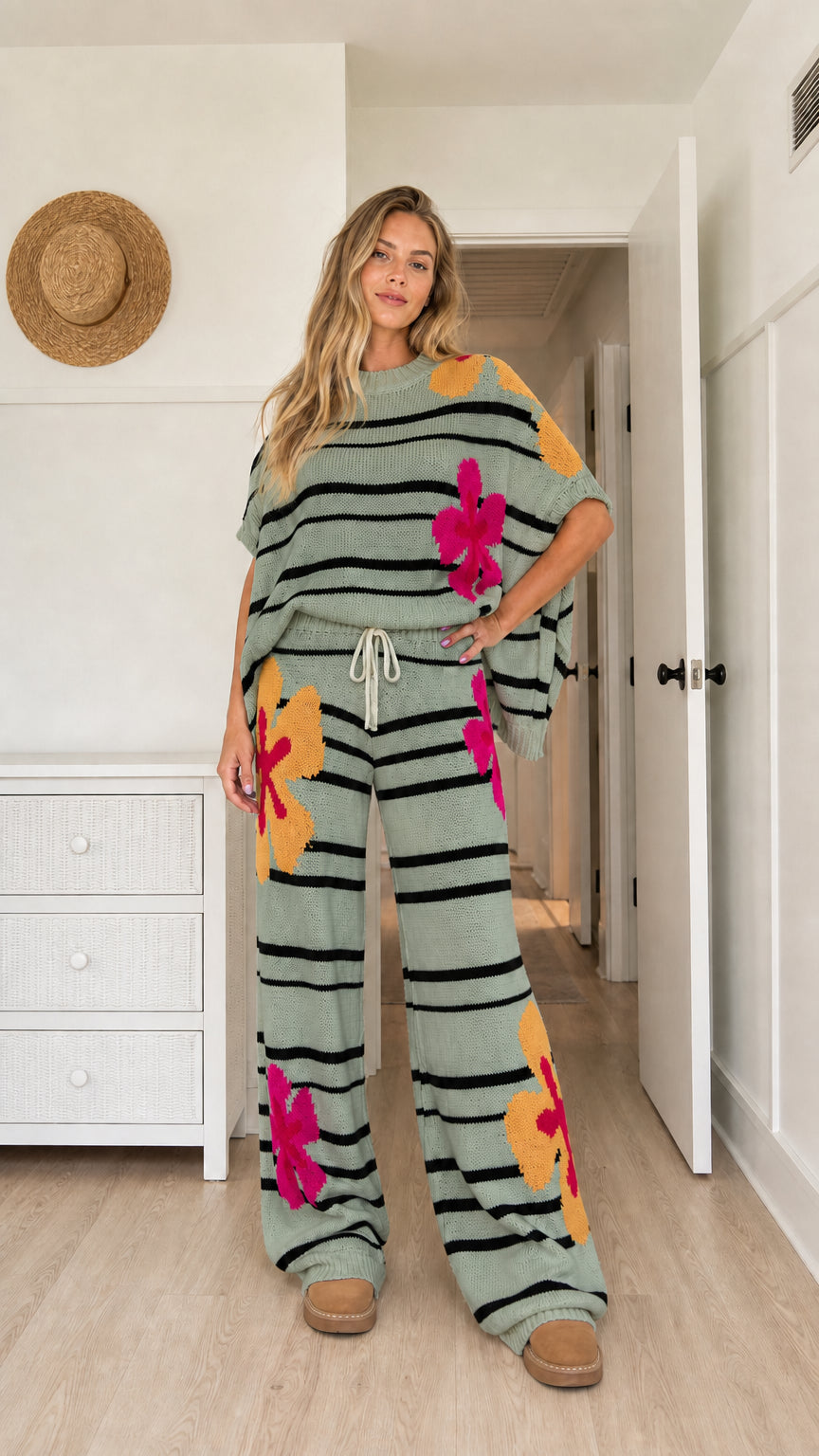 Model wearing sage green floral striped knit lounge set with wide-leg pants