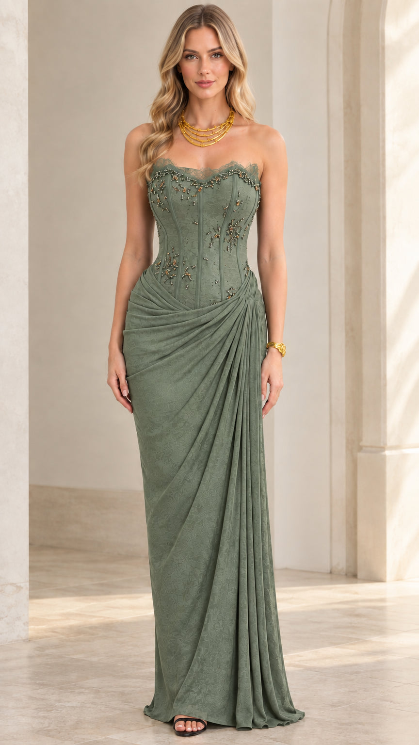 Model wearing sage green strapless corset draped maxi dress
