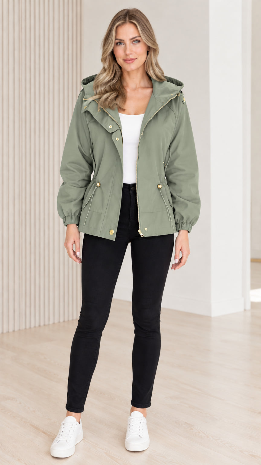 Front view of model wearing sage green hooded drawstring utility jacket