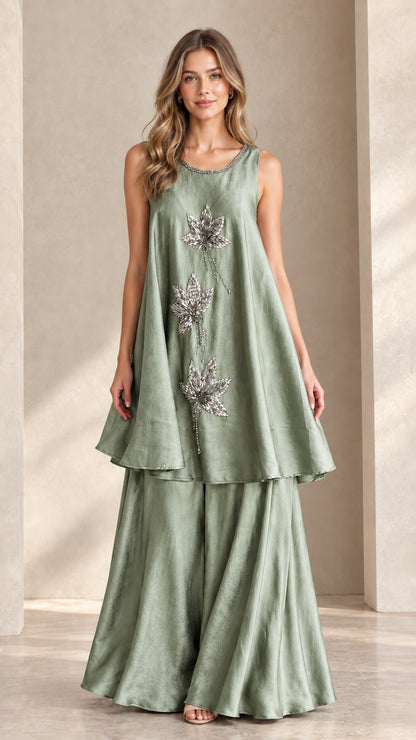 Front view of sage green sleeveless beaded tunic and palazzo pant set