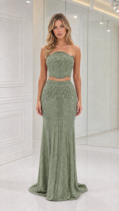 Model wearing Sage Green strapless beaded two-piece mermaid gown