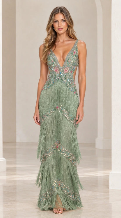 Model wearing sage green beaded and fringed floor-length evening dress