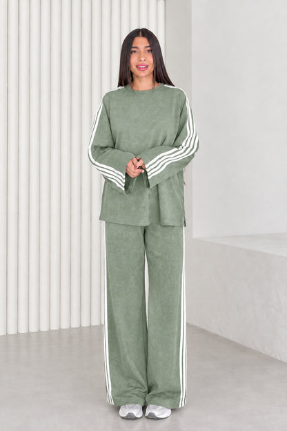 Full length view of model wearing sage green two-piece striped lounge set