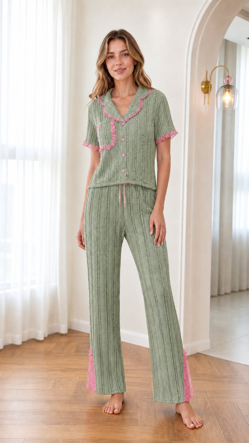 Sage green knit two-piece pajama set with pink lace trim on model