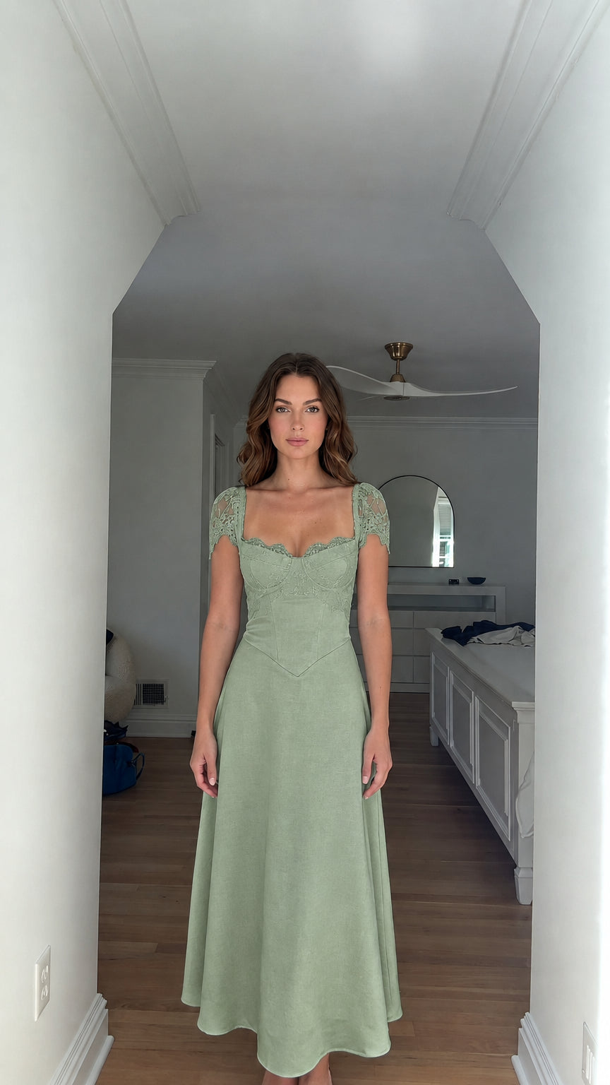 Model wearing sage green sweetheart corset A-line maxi dress