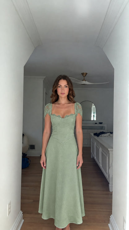Model wearing sage green sweetheart corset A-line maxi dress