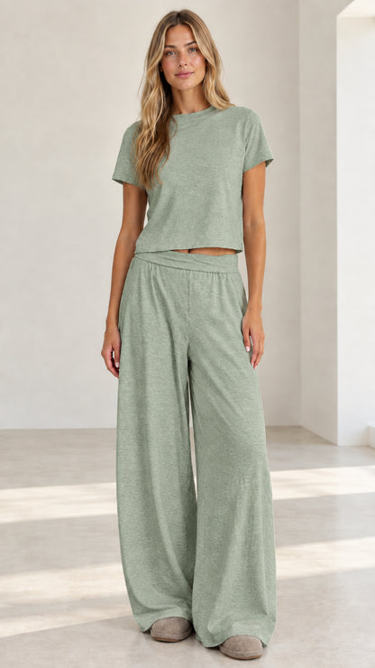 Model wearing sage green matching crop tee and wide leg palazzo lounge pants set