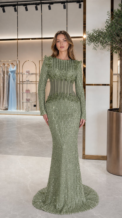 Front view of Sage Green long sleeve sequin gown with illusion corset waist